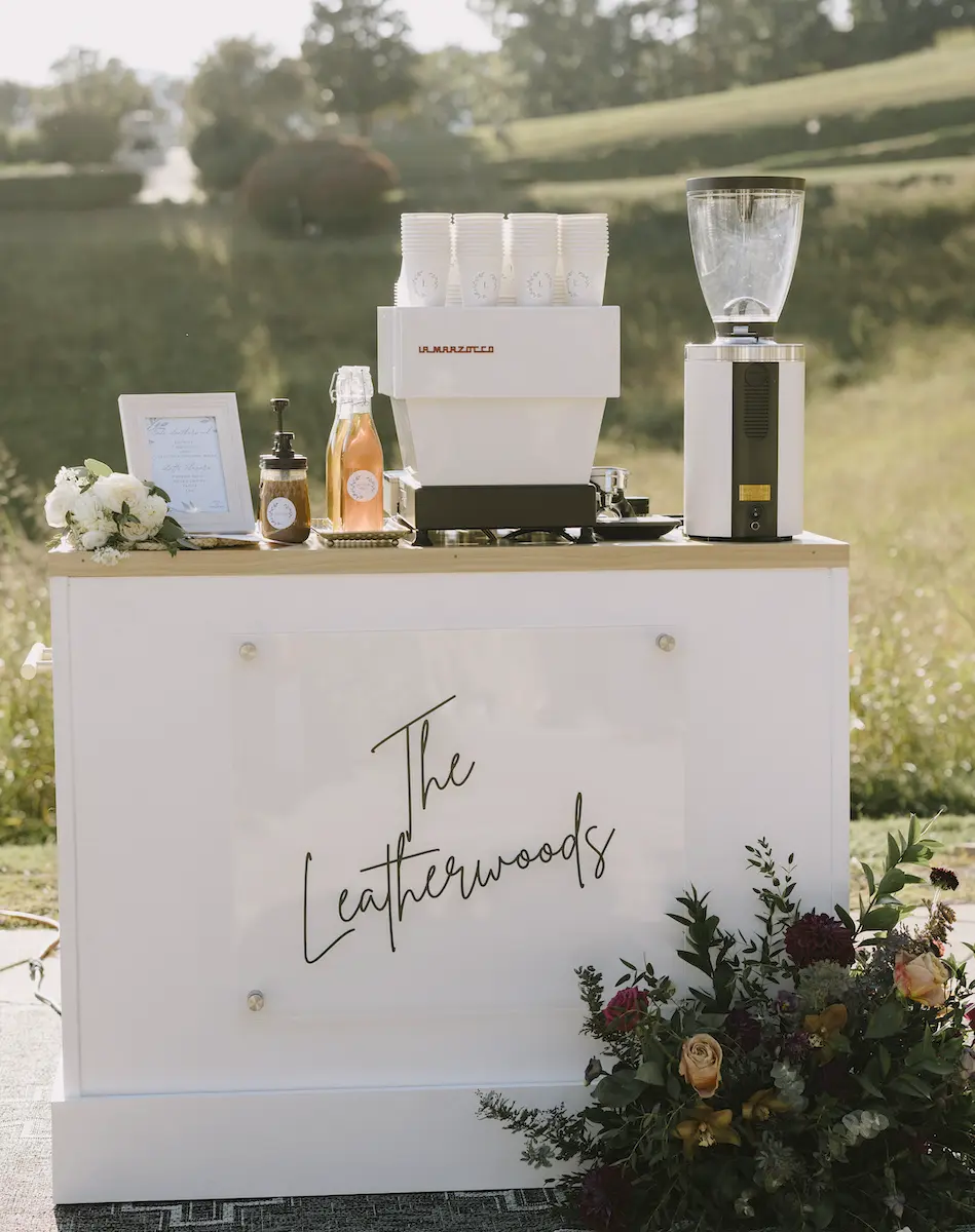 Custom Roaming Spirts Coffee espresso cart with light wood bar top outdoors for a wedding event