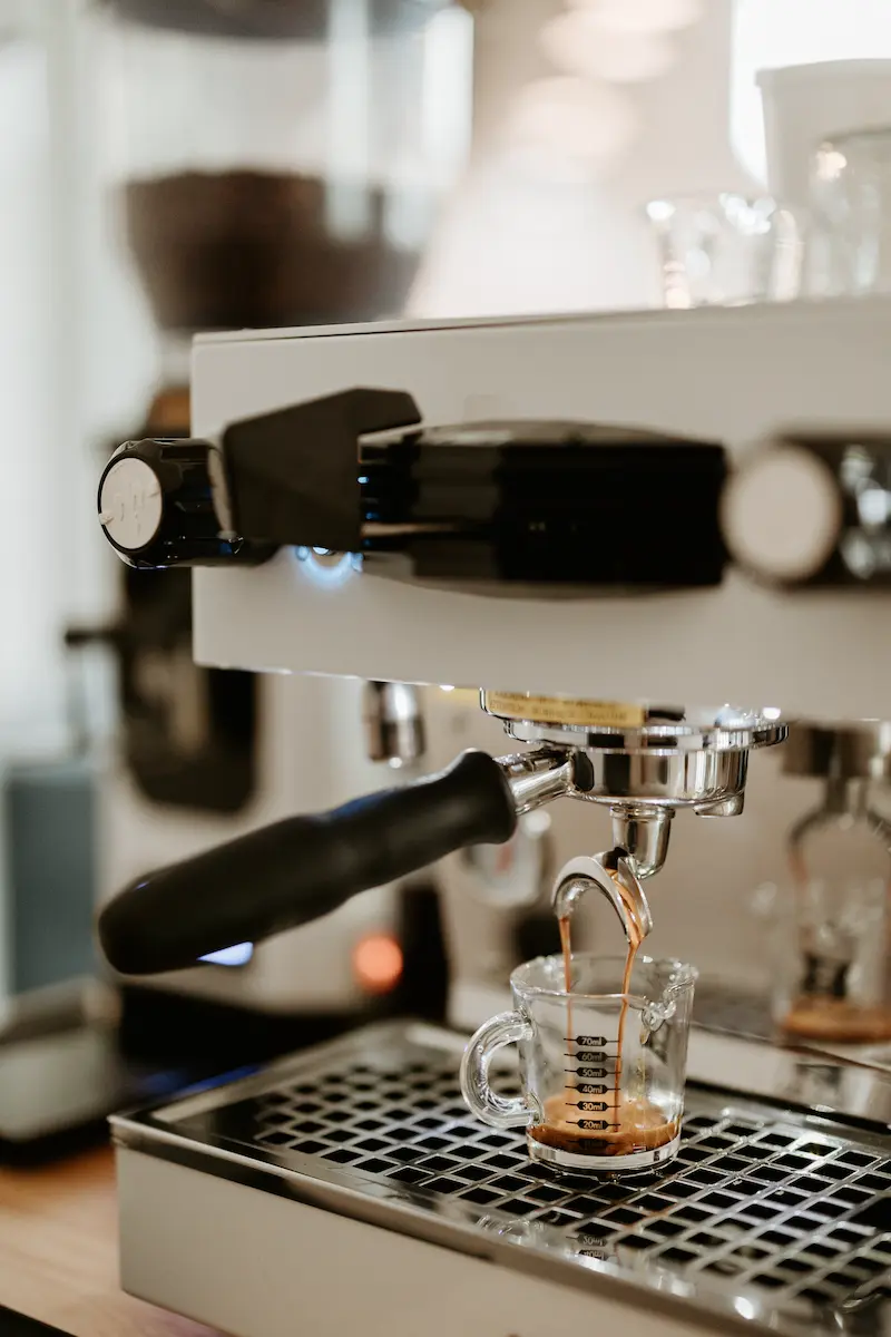 An espresso machine pouring a shot