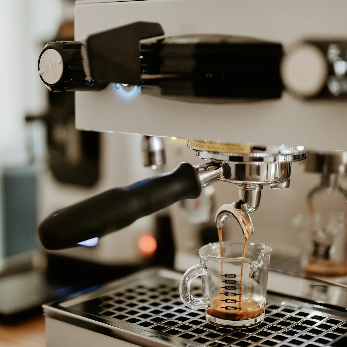 An espresso machine pouring a shot